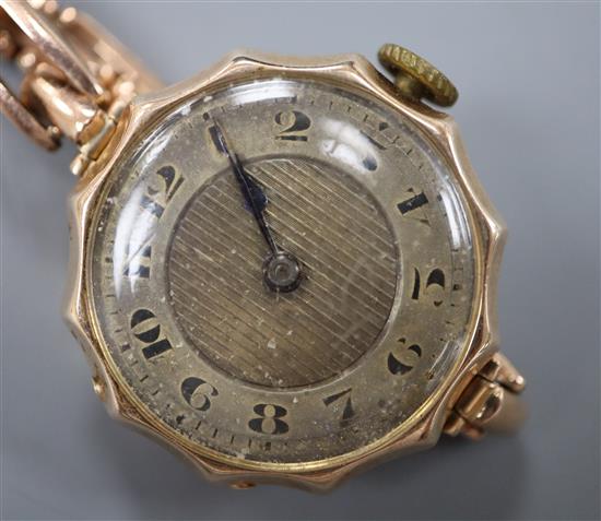 A 1920s 9ct gold wrist watch, on a 9ct expanding bracelet.